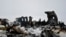 FILE: The wreckage of a U.S. military aircraft that crashed in the central Afghan province of Ghazni on January 27.