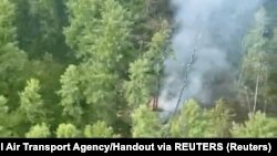 د روسۍ الوتکې پرېوتو له ځایه لوګي خېژي - د جولای ۲۴مې انځور.