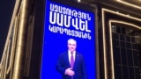 Armenia - A video screen on a shopping mall in Yerevan owned by Samvel Karapetian demands his release from prison, November 29, 2025.