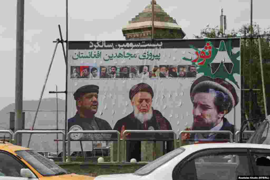 Public portraits of former mujahedin fighters remain a common fixture in Kabul. Here, Mohammad Fahid, Burhanuddin Rabbani, and Ahmad Shah Masud.&nbsp;