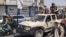 Victorious Taliban fighters drive an Afghan National Army vehicle through the streets of Laghman Province.